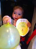 baby holding note from grammy