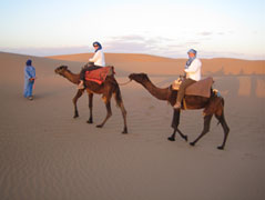 Carol & Barb at Caroll on camels in Morocco